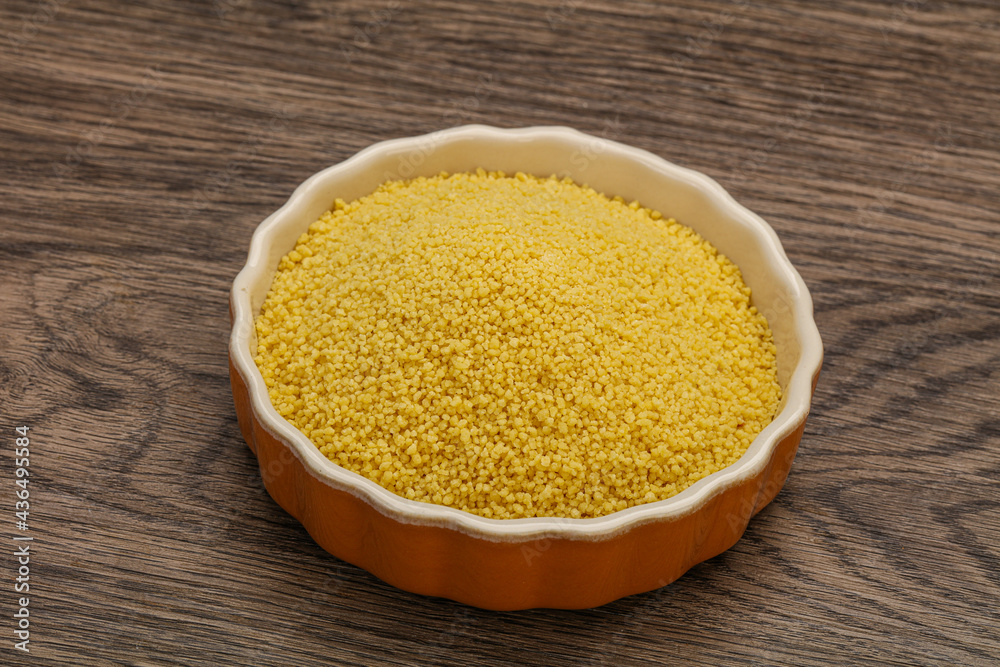 Raw cous cous heap in the bowl Raw cous cous heap in the bowl