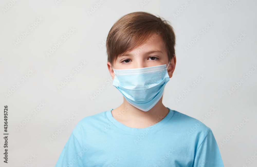 School boy with face mask on white background School boy with face mask on white background