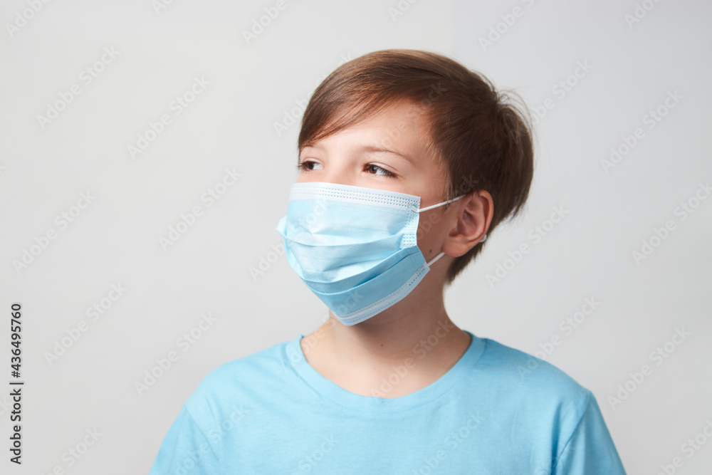 School boy with face mask on white background School boy with face mask on white background