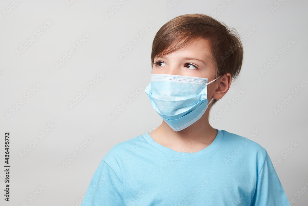 School boy with face mask on white background School boy with face mask on white background