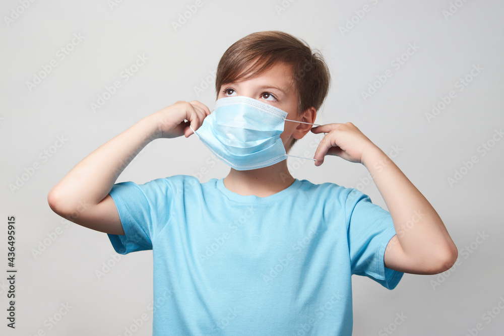School boy with face mask on white background School boy with face mask on white background
