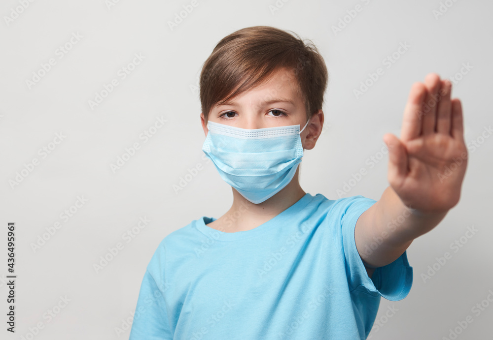 School boy with face mask on white background School boy with face mask on white background