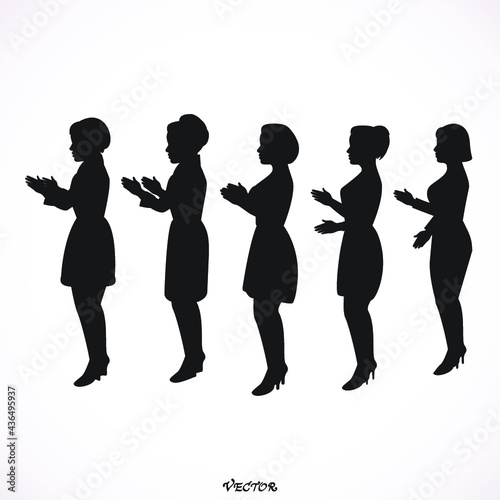 Side view of clapping women standing together against,  applause of the public after show. 