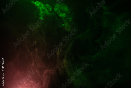 Green and pink steam on a black background.