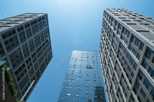 Looking Up Blue Modern Office Building