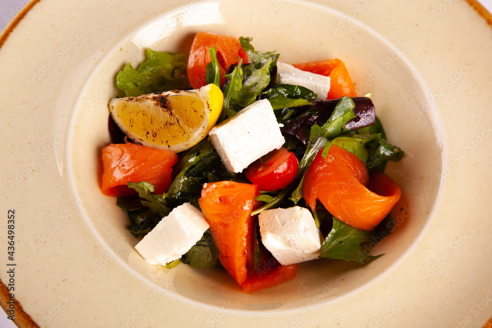 Salad with red fish and soft cheese