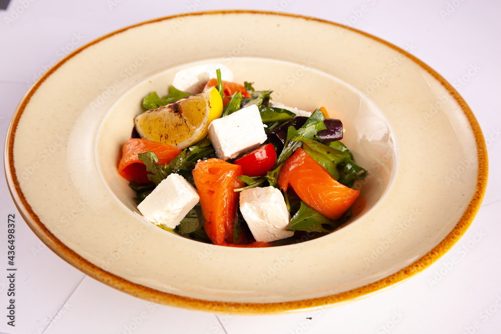 Salad with red fish and soft cheese