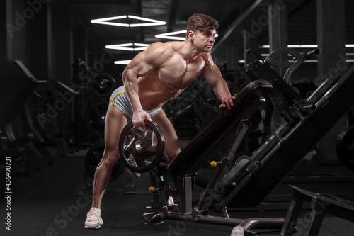 athletic man doing bent over row muscles