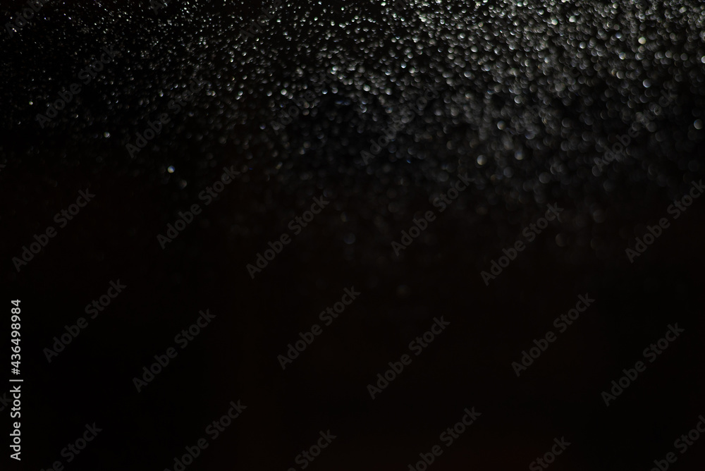 Blurred background with raindrops and lights. Blurred background with raindrops and lights.