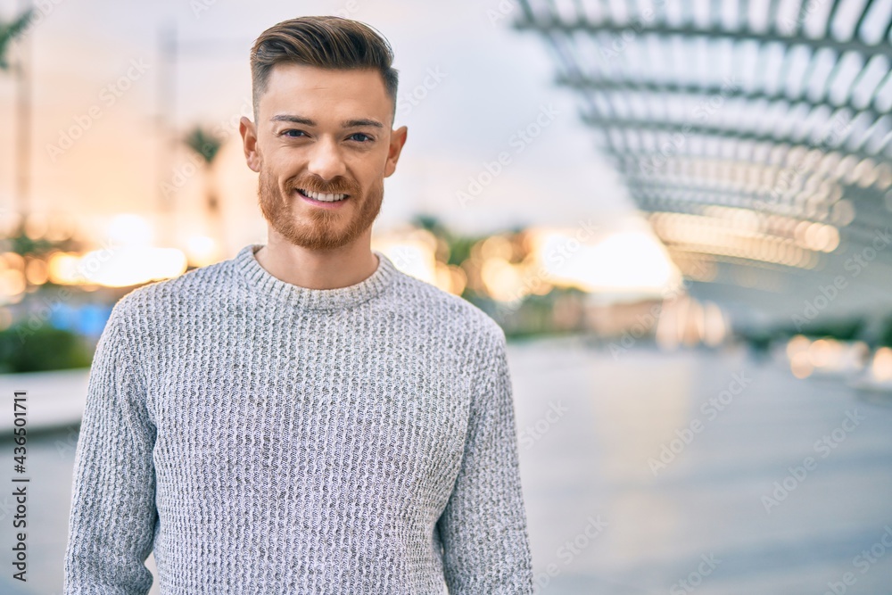 Young caucasian man smiling happy standing at the city. Young caucasian man smiling happy standing at the city.