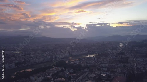 drone flying above the florence roofs, rivers and bridges with panoramic view