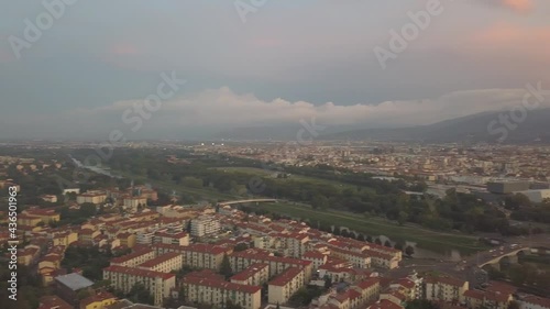 drone flying above the florence roofs, rivers and bridges with panoramic view