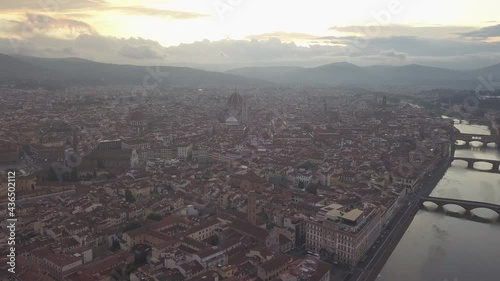 drone flying above the florence roofs, rivers and bridges with panoramic view