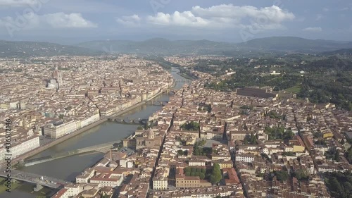 drone flying above the florence roofs, rivers and bridges with panoramic view