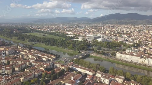 drone flying above the florence roofs, rivers and bridges with panoramic view