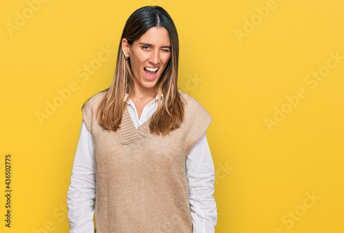 Young woman wearing casual clothes winking looking at the camera with sexy expression, cheerful and happy face. © Krakenimages.com