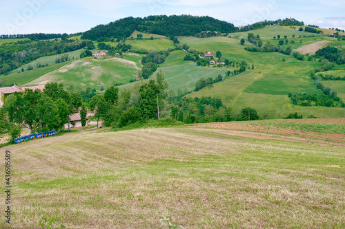 Panorama of the hills of Oltrepo Pavese, countryside area in Northern Italy, Lombardy Region, at the borders with Emila. this area is famous for its valuable red wines and cold cuts production. photo