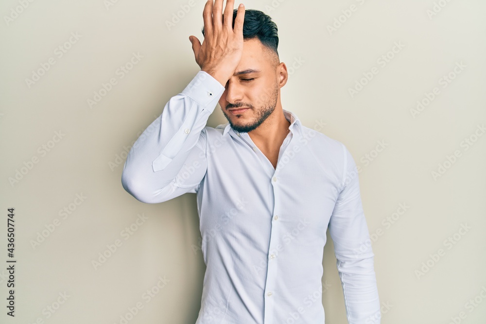 Young arab man wearing casual clothes surprised with hand on head for mistake, remember error. forgot, bad memory concept. Young arab man wearing casual clothes surprised with hand on head for mistake, remember error. forgot, bad memory concept.
