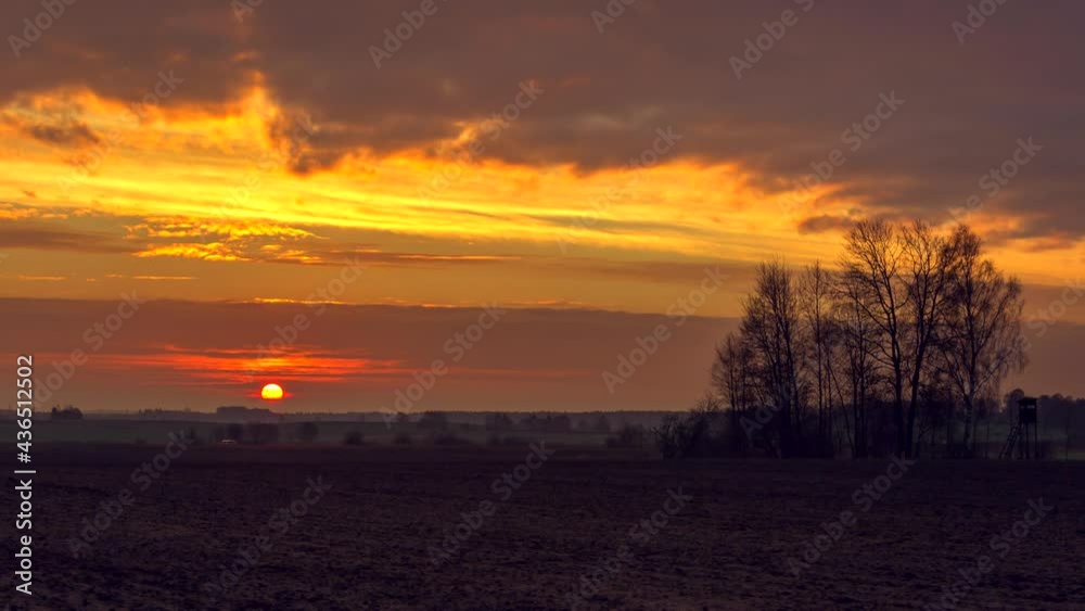 Sunrise over fields. Time lapse with closed up sun shield of sun. Sunrise over fields. Time lapse with closed up sun shield of sun.