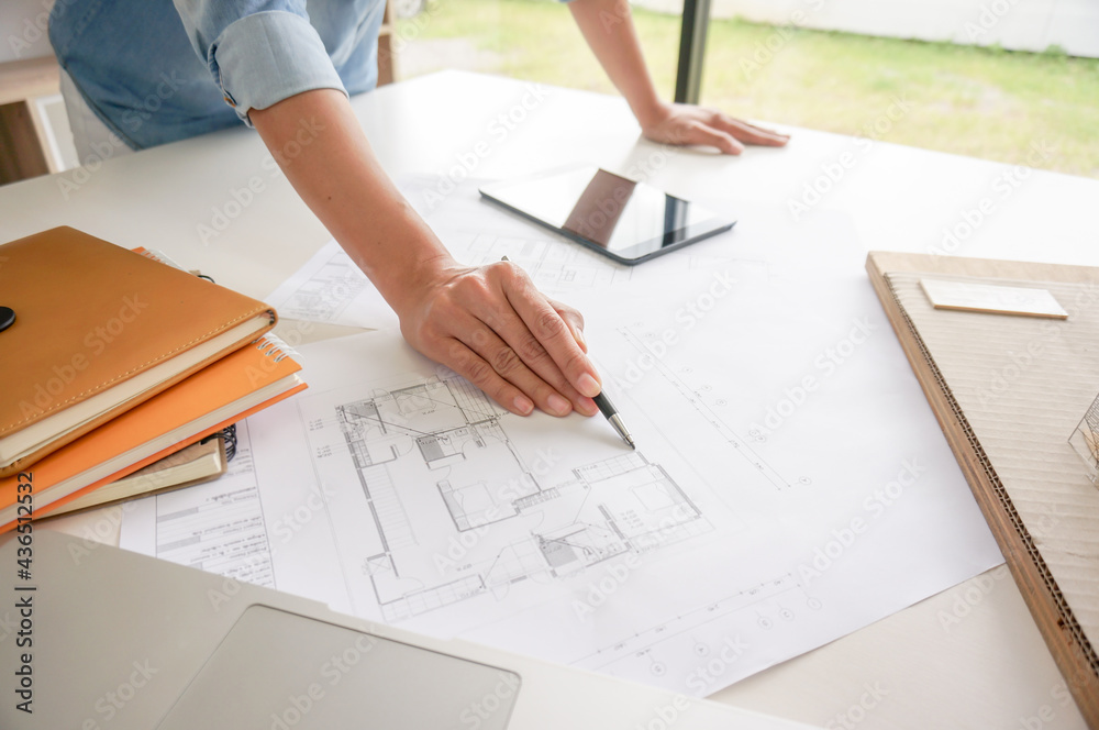 Architecture drawing on architectural project business architecture building construction Colleagues interior designer Corporate. Planning Design on blueprint Teamwork with compasses. Architecture drawing on architectural project business architecture building construction Colleagues interior designer Corporate. Planning Design on blueprint Teamwork with compasses.