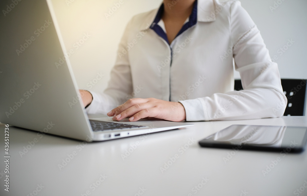 Woman working by using a laptop computer Hands typing on keyboard. writing a blog. Working at home are in finger typewriter Woman working by using a laptop computer Hands typing on keyboard. writing a blog. Working at home are in finger typewriter