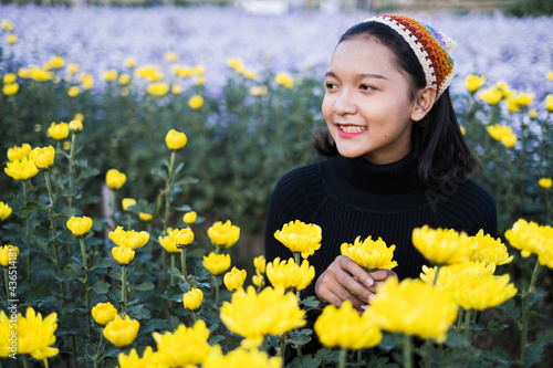 Beautiful girl with yeloow flower. photo