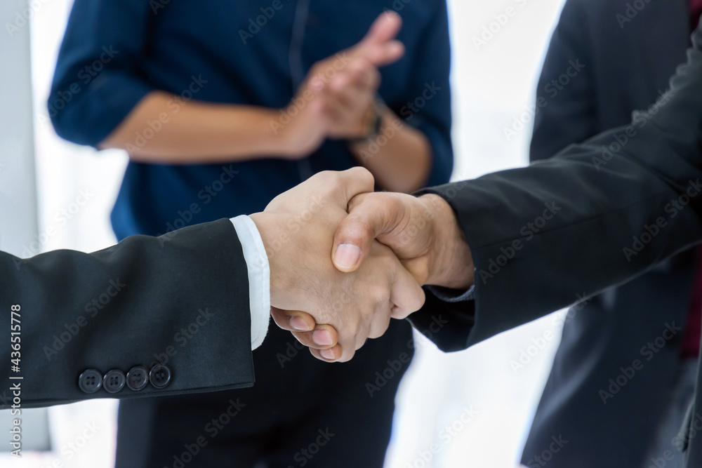 Partnership. business people group handshake and clapping hand after finishing up business meeting in office, congratulation on promotion, success, partner, teamwork, community, connection concept