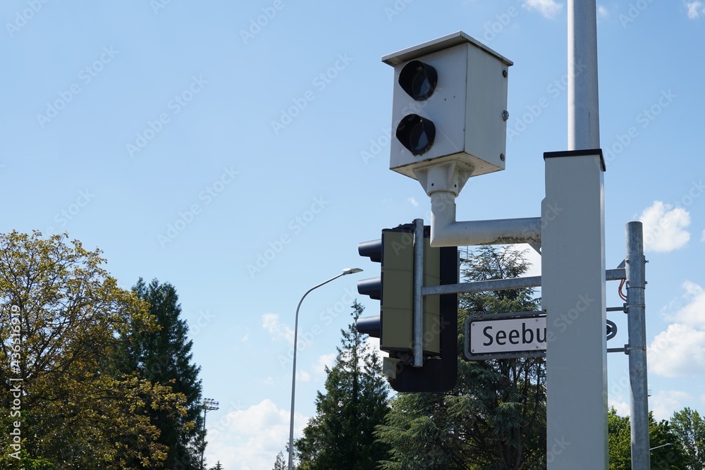 Speed camera mounted on a pole for monitoring a road. The camera uses a radar system which can detect the speed of the motorists and photograph vehicles which exceed speed limit. Speed camera mounted on a pole for monitoring a road. The camera uses a radar system which can detect the speed of the motorists and photograph vehicles which exceed speed limit.
