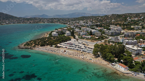 Aerial drone photo of popular to Athenians close to Athens beach of Agios Spyridonas with small chapel by the sea, Porto Rafti, Attica, Greece photo