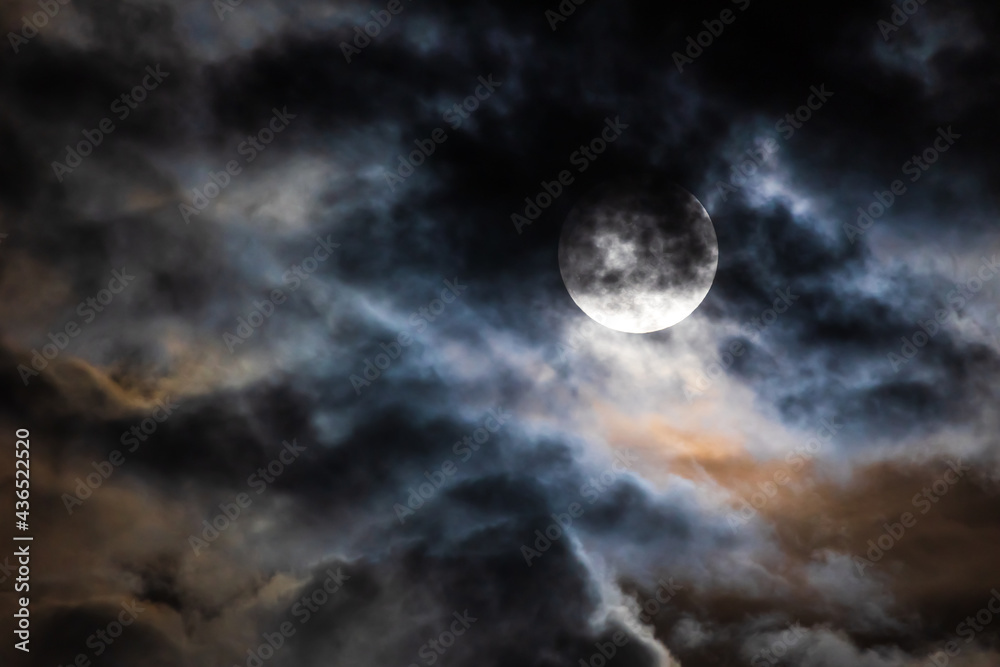 Flower Moon on Cloudy Night Sky