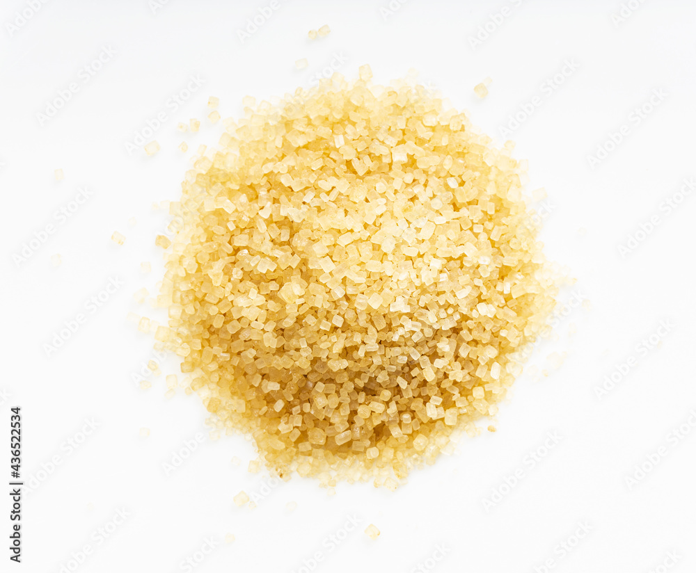 pile of demerara brown cane sugar close up on gray pile of demerara brown cane sugar close up on gray