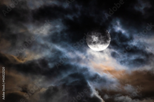Flower Moon on Cloudy Night Sky