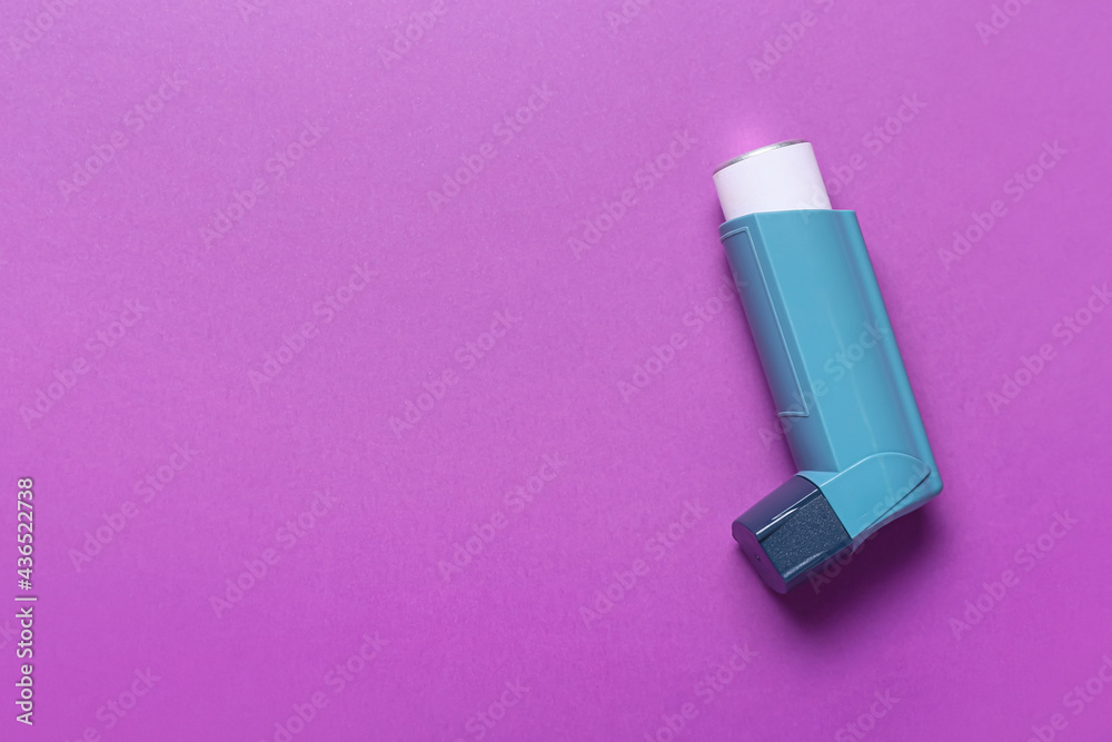 Modern inhaler on color background Modern inhaler on color background