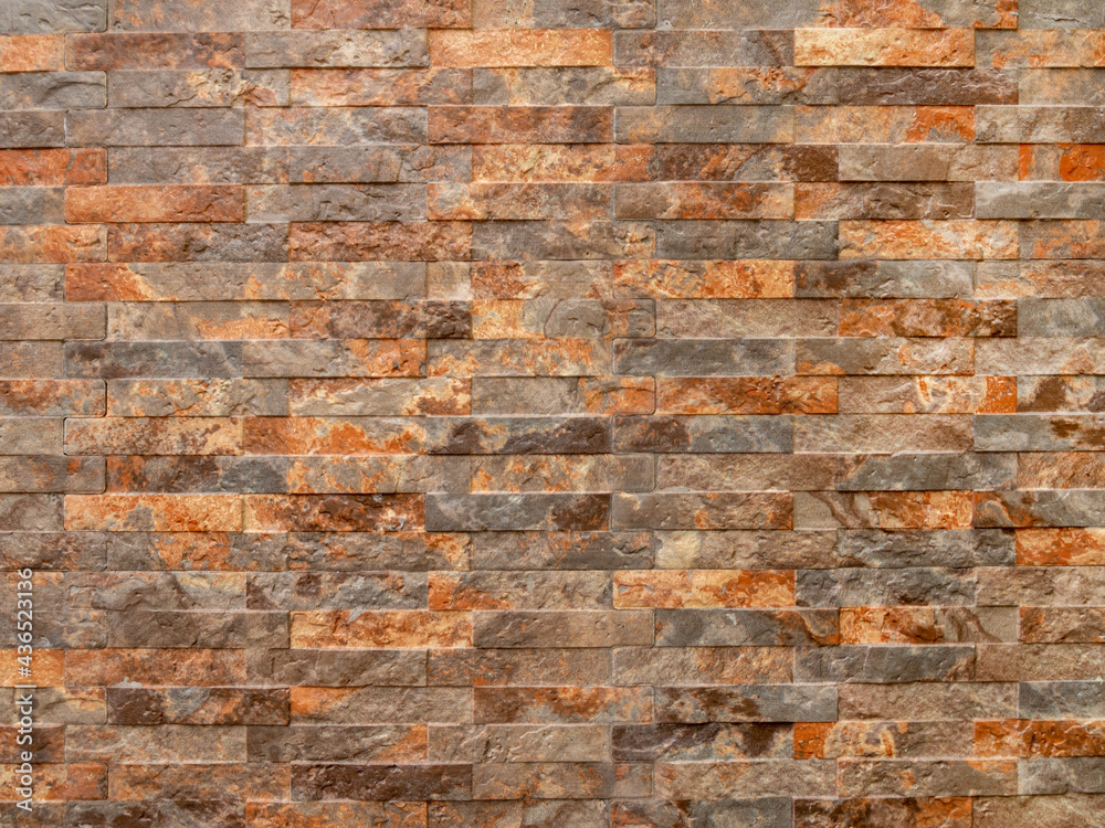 Obraz premium Brick wall made of natural stone of different colors. Marble decorative texture.