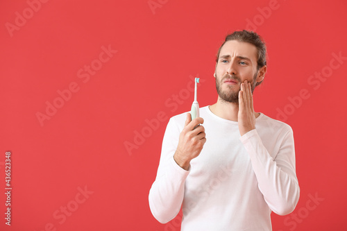 Young man experiencing toot...