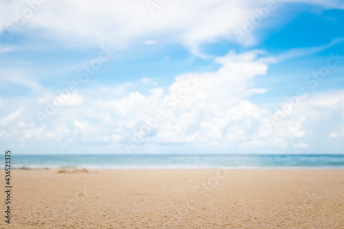 Blurry tropical sea and beach with blue sky.