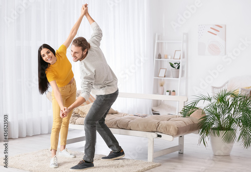 Happy young couple dancing ...