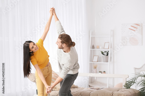 Happy young couple dancing ...