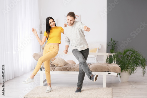 Happy young couple dancing ...