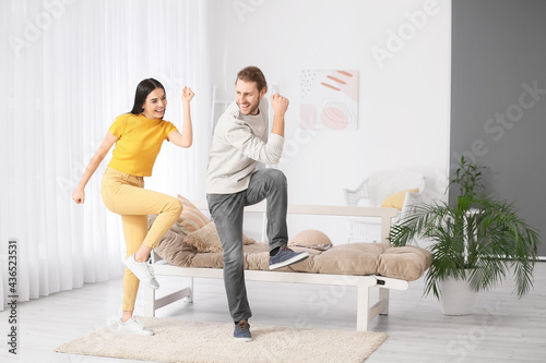 Happy young couple dancing ...