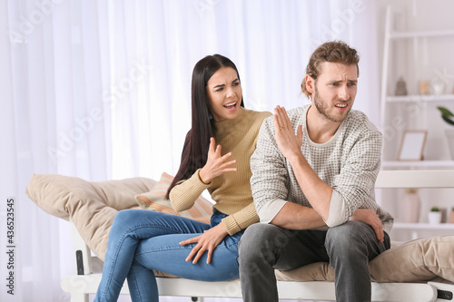 Young quarrelling couple at...