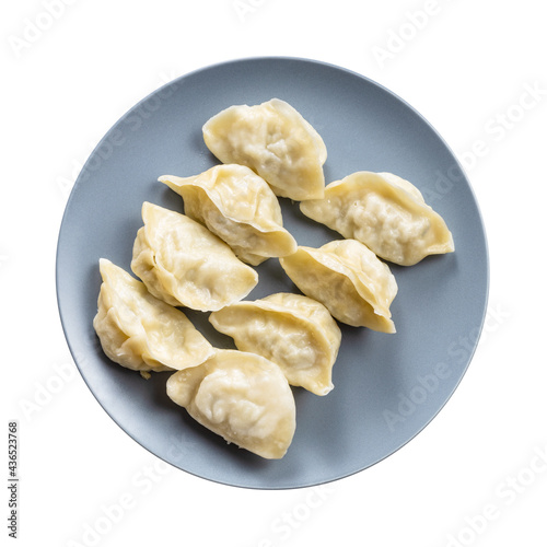 top view of several boiled dumplings on gray plate
