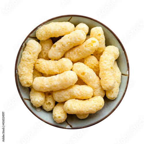 top view of corn puffs in ceramic bowl isolated