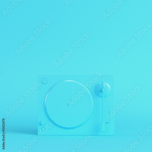 Turntable on bright blue background in pastel colors