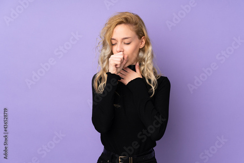 Young blonde woman isolated on purple background is suffering with cough and feeling bad