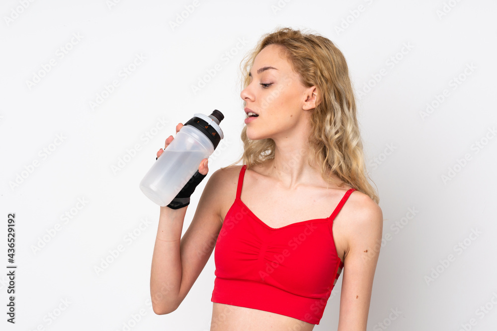 Young blonde woman isolated on white background with sports water bottle Young blonde woman isolated on white background with sports water bottle