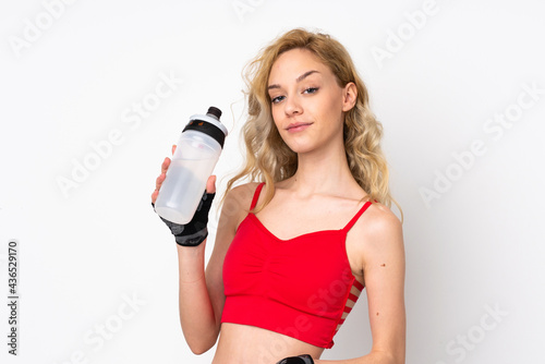 Young blonde woman isolated on white background with sports water bottle © luismolinero