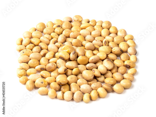 handful of dried soybeans closeup on white