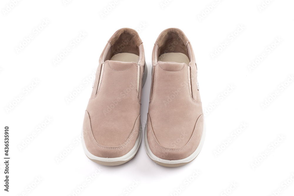 Pair of running shoes isolated in white background. Close-up of elegant gray shoes for adult man on white background.