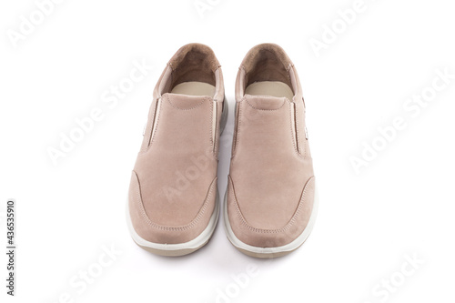 Pair of running shoes isolated in white background. Close-up of elegant gray shoes for adult man on white background.
